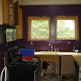 A friend of mine helped me put up the wall cabinets and microwave. I cut holes and ran wires for task lighting and speakers in the ceiling.
