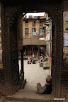 Looking through a gate onto a square