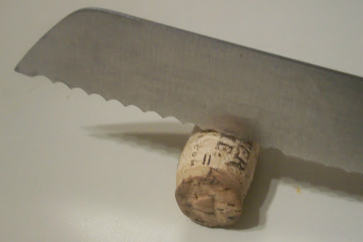 Carefully cut corks using a serrated knife.