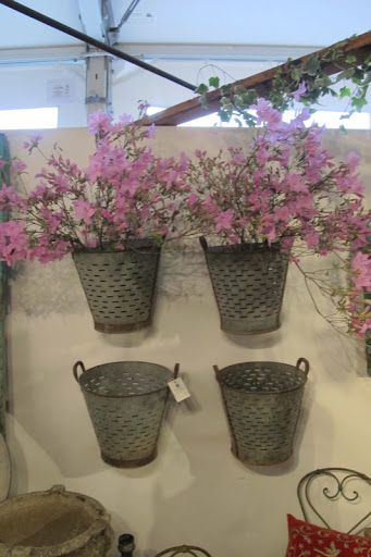 This is a just a small sampling of a large number of Belgian tin buckets. I love how they were displayed.