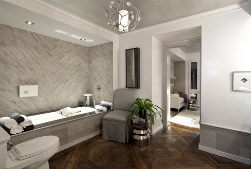 It's all about the tile here. The herringbone pattern transforms what could be a boring wall into a focal point. (Cayley Barrett Associates, LTD)