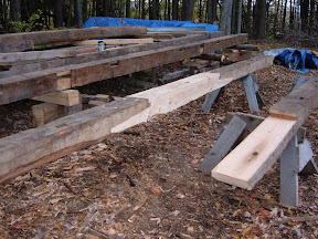 One of the sill girts had a rotten end.  We split the girt with a repair in the middle that is supported with a post and braces.