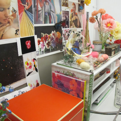 Hints of floral imagery decorate my bulletin board, echoing the colorful blossoms on my desk. Hints of floral imagery decorate my bulletin board, echoing the colorful blossoms on my desk.