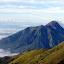 Merapi emerging from the clouds, with villages and farmland up its slopes