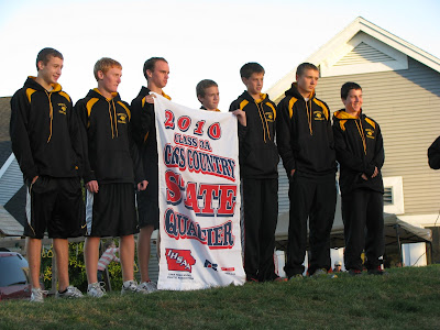 Knoxville Boys Cross Country Squad receives the state banner. (submitted by Pat Ryan)
