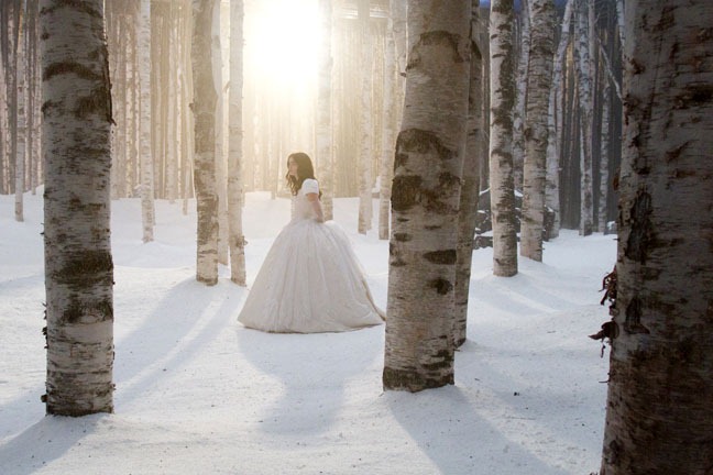 Lily Collins stands alone in the woods set of "Snow White," September 13, 2011