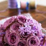 set of flowers and jewelries over wooden table