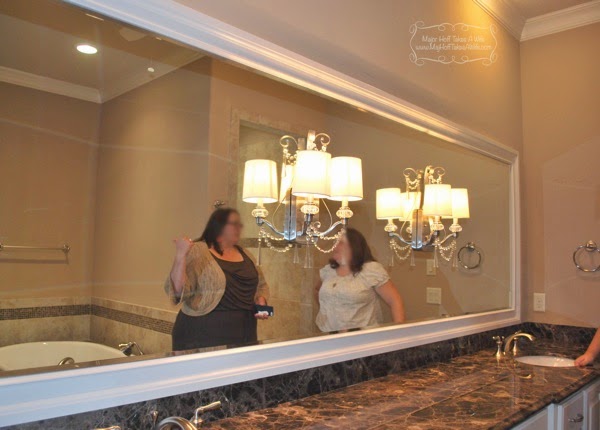 long horizontal builder mirror framed with light fixtures on mirror.jpg Long horizontal builder mirror framed with light fixtures on mirror