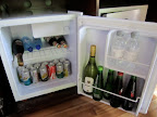 Obligatory mini-bar shot - part 2 (bubbles, both sparkling and still water, beers, dry lemon, diet coke, soda water, coke, ginger ale, tonic water, which wine, appletiser and grapetiser. Behind the fridge door on the right is the safe and a bottle of red wine and a bottle of amarula).