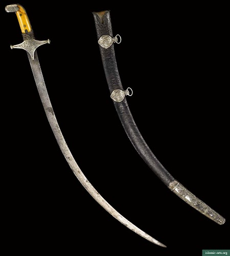 A SILVER MOUNTED SWORD WITH IVORY GRIPS AND SCABBARD, OMAN,