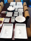 She modified it by buying various white platters and arranging them in a cohesive layout. Here, a trial run at her mom's house, with each piece labeled with the food it would hold.