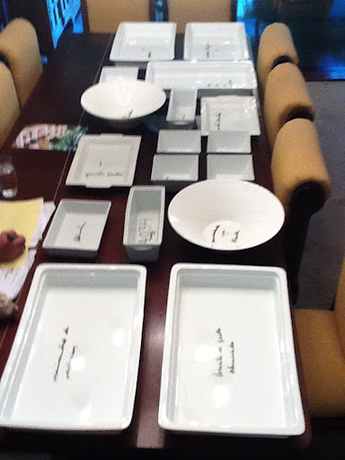 She modified it by buying various white platters and arranging them in a cohesive layout. Here, a trial run at her mom's house, with each piece labeled with the food it would hold.