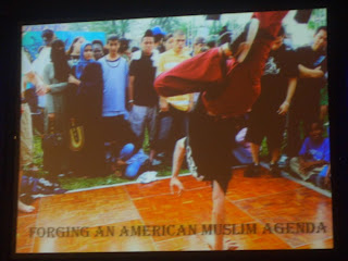 One of Zaid Shakir's slide. Break-dancing Muslims with munaqiba and muhajiba in audience. "Diversity"
