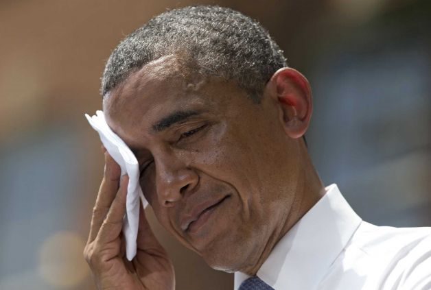 President Barack Obama wipes sweat from his head during a speech on climate change, Tuesday, 25 June 2013, at Georgetown University in Washington. Obama is proposing sweeping steps to limit heat-trapping pollution from coal-fired power plants and to boost renewable energy production on federal property. Photo: Evan Vucci