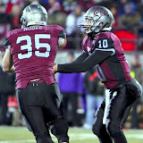 Jordan Johnson hands the ball off to Dan Moore.