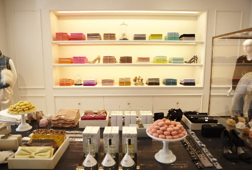 Accessories galore. They have great gifts and items you can wear everyday like these colorful cashmere sweaters, belts, clutches, perfume, and shoes.