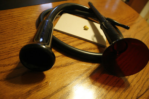 Featured are two antique Ear Trumpets alongside the newest form of hearing aid named the Lyric. The Lyric can be worn for three months straight then is traded and disposed of. (Photo by: Kenrick Nobles)