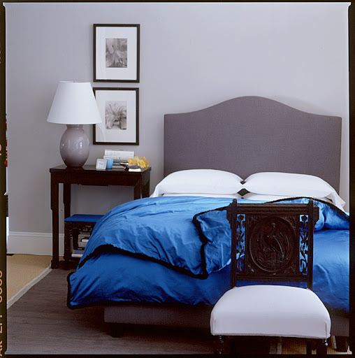 Don't be afraid to use a bold color in the bedroom. The soft grays in this room prevent it from being overwhelming. Don't be afraid to use a bold color in the bedroom. The soft grays in this room prevent it from being overwhelming.