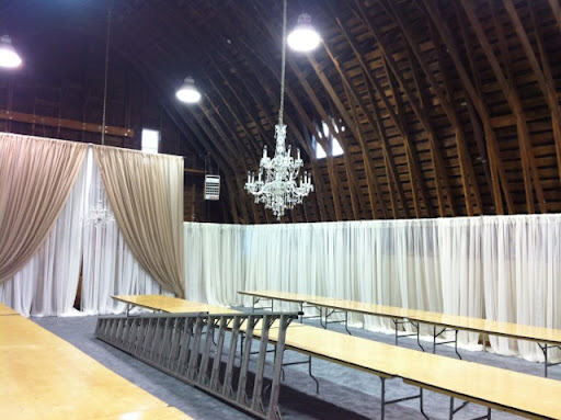 The last step before covering and decorating the tables was to hang two crystal chandeliers.