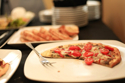 I really wanted the reception to be very intimate so we rented out Cafe di Scala (http://www.cafediscala.com/), one of the best Italian restaurants in Des Moines. It's in an old Victorian house, so it's welcoming and interesting architecturally. The meal was huge—this homemade pizza was just one of many appetizers we served. I really wanted the reception to be very intimate so we rented out Cafe di Scala (http://www.cafediscala.com/), one of the best Italian restaurants in Des Moines. It's in an old Victorian house, so it's welcoming and interesting architecturally. The meal was huge—this homemade pizza was just one of many appetizers we served.