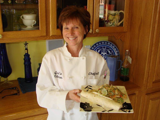 Gail proudly posing with her finished dish. Her lovely chef's jacket was a gift from her husband -- What a wonderful guy!