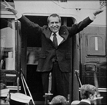 c0 President Nixon giving his trademark peace sign.