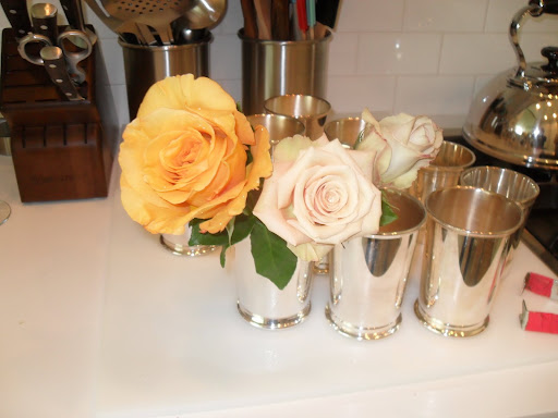 Using clean vases is very important for the flowers, also the warmer the water the faster the roses will open.
