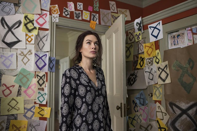 Jocelyn (Lena Headey) goes to Clary's room and sees dozens of rune drawings in Screen Gems fantasy-action THE MORTAL INSTRUMENTS: CITY OF BONES.