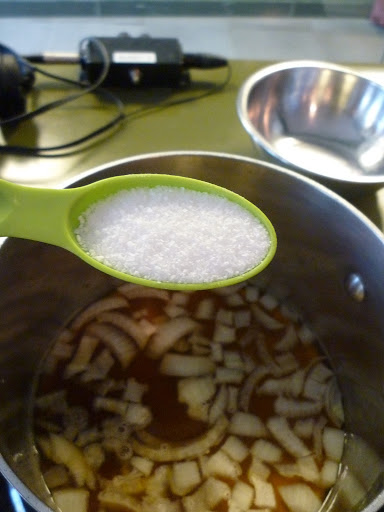 Adding some coarse salt to the pan.