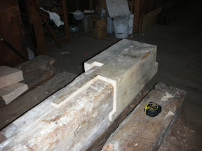 Shown here is a strange looking post foot repair, prior to surfacing,  designed to avoid mortises and several knot clusters.