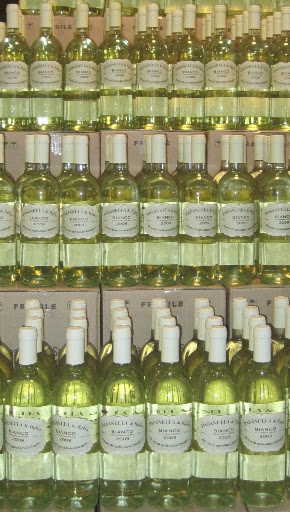 Take a cue from your local wine shop and display multiple bottles of your favorite wine, the prettier the label the better. (pasanellaandson.com)