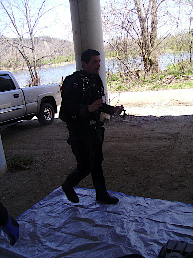 Scott in his dry suit walking on our clean tarp.