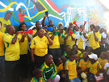 The last day of school last term, Mahlahluvana gathered everyone in front of the World Cup mural we'd painted to celebrate and get ready for the World Cup to begin that Friday! South Africa - 377.jpg