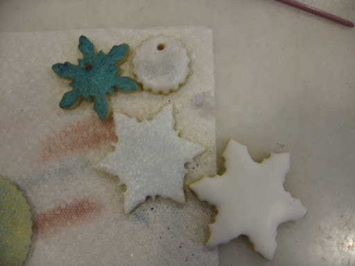 I love luster dust. It mimicks powdered eyeshadow in texture and richness of color, but you can decorate your cookies with it! And a little goes a very, very long way. You can brush it straight onto the cookie, or onto the dried royal icing.