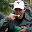 Andrew shoveling down his meal