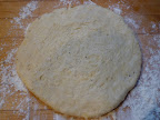 Dough kneaded and rolled out to a 7-inch round.