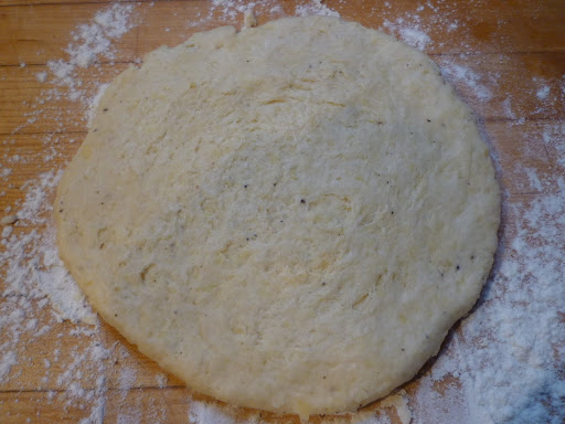 Dough kneaded and rolled out to a 7-inch round.