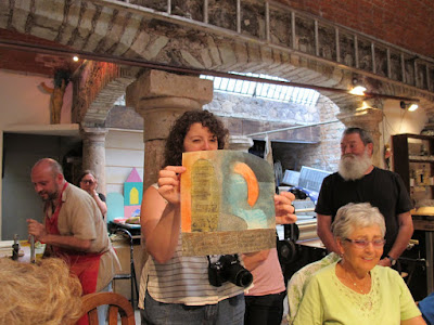 Renee holds Hugo's print