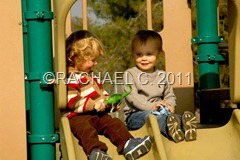 blake and emerson on slide at park