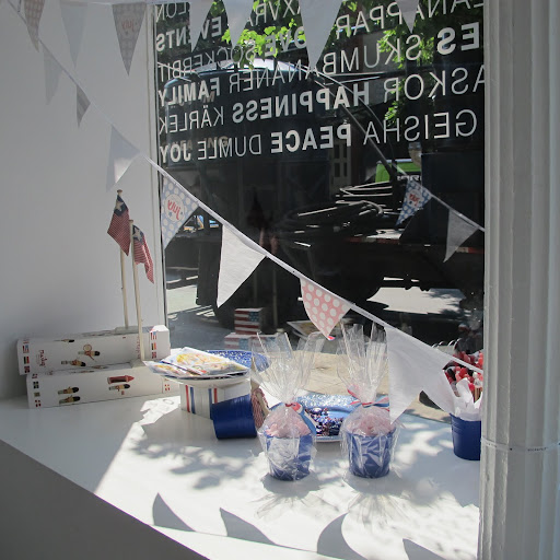 Red, white and blue bunting decorates the window.