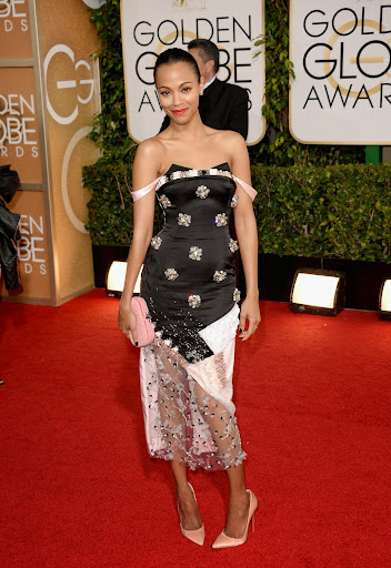Zoe Saldana opted for a more fashion forward take on a standard red carpet trend when she selected this embellished cocktail dress by Prabal Gurung. Heed Zoe’s style wisdom and accessorize daring looks with simple pointed toe pumps, a slicked back chignon and a classic box clutch. Zoe Saldana opted for a more fashion forward take on a standard red carpet trend when she selected this embellished cocktail dress by Prabal Gurung. Heed Zoe’s style wisdom and accessorize daring looks with simple pointed toe pumps, a slicked back chignon and a classic box clutch.