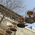 Bird cages hung beneath the Drum Tower of Yu Xian, Hebei.
