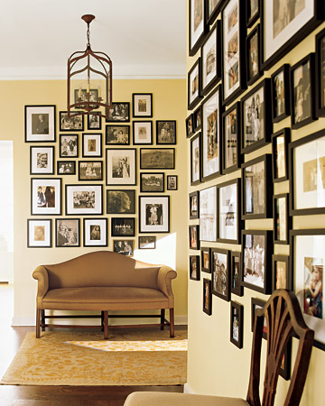 A pale yellow is the perfect backdrop for a collection of photos in black frames. A pale yellow is the perfect backdrop for a collection of photos in black frames.