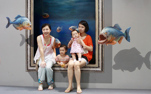 3D Painting Exhibition In Hangzhou...HANGZHOU, CHINA - JULY 01: People pose with a 3D painting during the 2012 Magic Art Special Exhibition Of China at Hangzhou Peace International Exhibition and Conference Center on July 1, 2012 in Hangzhou, China. The exhibition will run from July 1 to August 6 in Hangzhou.  PHOTOGRAPH BY China Foto Press / Barcroft Media  UK Office, London. T +44 845 370 2233 W www.barcroftmedia.com  USA Office, New York City. T +1 212 796 2458 W www.barcroftusa.com  Indian Office, Delhi. T +91 11 4053 2429 W www.barcroftindia.com