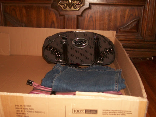Out of season clothing, extra totes, and even shoes slide under the dresser.