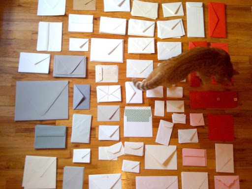 While making the guest book, the floor of my apartment was covered in envelopes as I organized them by color and shape. Here, Marmalade is helping me. While making the guest book, the floor of my apartment was covered in envelopes as I organized them by color and shape. Here, Marmalade is helping me.