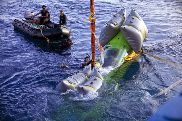 The DEEPSEA CHALLENGER piloted by James Cameron is lowered into the water at the beginning of a dive to 8,221 meters.