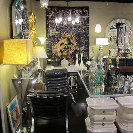 Amidst the multitude of great pieces in this dealers area, it's hard to notice the gorgeous glass desk.