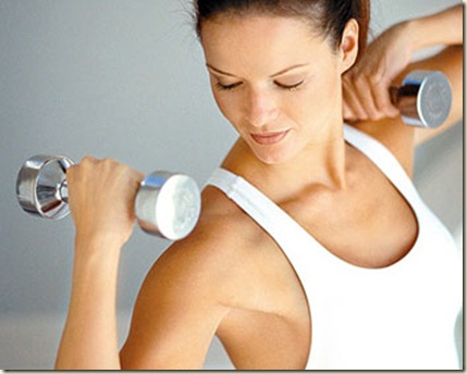 ca. 1999 --- Woman Exercising with Weights --- Image by © Michael Keller/CORBIS