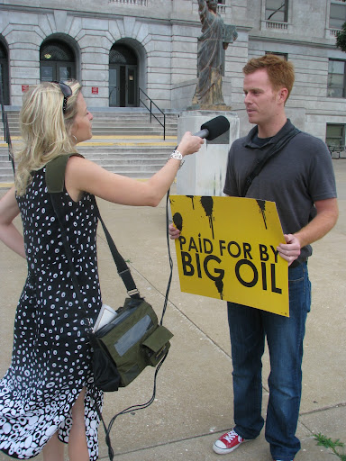Josh Jones voices his opinion on Roy Blunt's affiliation with the oil industry to reporter Jennifer Moore. (Photo by: Kenrick Nobles)